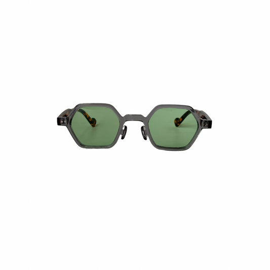 Sunglasses with green lenses and black frames on a white background