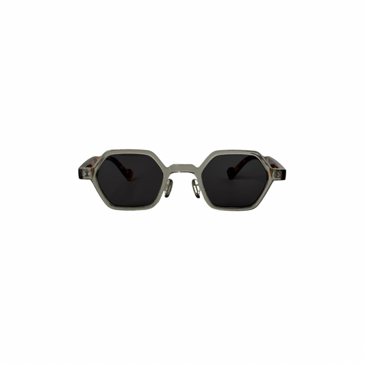 Hexagonal sunglasses with dark lenses on a white background